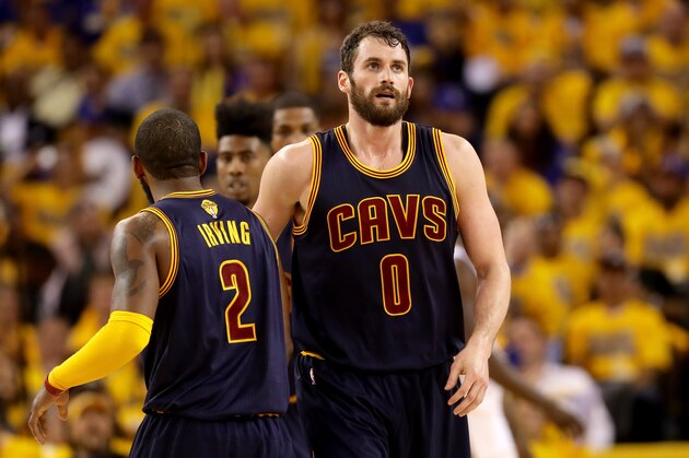 OAKLAND, CA - JUNE 02:  Kevin Love #0 of the Cleveland Cavaliers reacts alongside teammate Kyrie Irving #2 in the second half while taking on the Golden State Warriors in Game 1 of the 2016 NBA Finals at ORACLE Arena on June 2, 2016 in Oakland, California. NOTE TO USER: User expressly acknowledges and agrees that, by downloading and or using this photograph, User is consenting to the terms and conditions of the Getty Images License Agreement.  (Photo by Ezra Shaw/Getty Images)