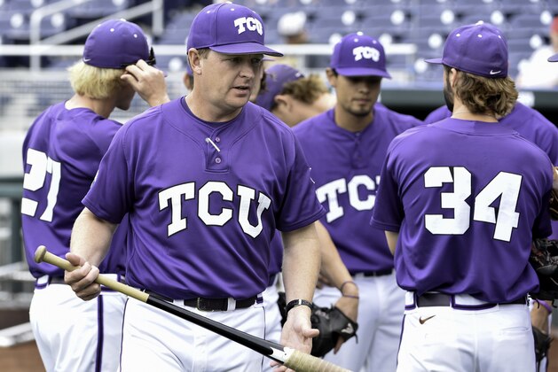 FILE- In this June 12, 2015, file photo, TCU coach Jim Schlossnagle, second left, carries a bat during team practice at TD Ameritrade Park in Omaha, Neb. TCU plays Florida in the NCAA baseball super regionals in Gainesville, Fla., starting on Saturday, June 11, 2016. (AP Photo/Mike Theiler, File)