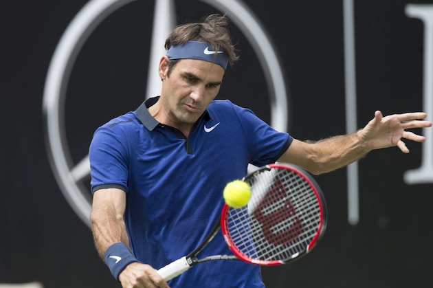 Switzerland's Roger Federer returns the ball to Germany's Florian Mayer in their quarterfinal match at the ATP Mercedes Cup tennis tournament in Stuttgart, southwestern Germany, on June 10, 2016.   / AFP / THOMAS KIENZLE        (Photo credit should read THOMAS KIENZLE/AFP/Getty Images)