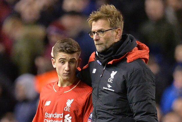 Liverpool's German manager Jurgen Klopp (R) speaks with Liverpool's English midfielder Cameron Brannagan after the end of the English FA Cup fourth round football match between Liverpool and West Ham United at Anfield in Liverpool, north west England, on January 30, 2016. / AFP / PAUL ELLIS / RESTRICTED TO EDITORIAL USE. No use with unauthorized audio, video, data, fixture lists, club/league logos or 'live' services. Online in-match use limited to 75 images, no video emulation. No use in betting, games or single club/league/player publications.  /         (Photo credit should read PAUL ELLIS/AFP/Getty Images)
