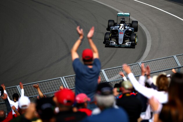 MONTREAL, QC - JUNE 10: Lewis Hamilton of Great Britain driving the (44) Mercedes AMG Petronas F1 Team Mercedes F1 WO7 Mercedes PU106C Hybrid turbo waves at the crowd on track during practice for the Canadian Formula One Grand Prix at Circuit Gilles Villeneuve on June 9, 2016 in Montreal, Canada.  (Photo by Dan Istitene/Getty Images)