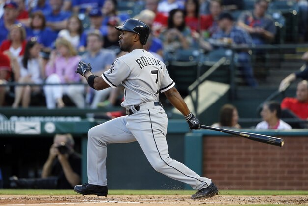 Chicago White Sox's Jimmy Rollins follows through on a swing against a pitch from Texas Rangers' Colby Lewis in the third inning of a baseball game, Monday, May 9, 2016, in Arlington, Texas. (AP Photo/Tony Gutierrez)