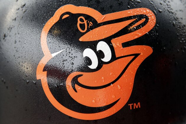 Rain drops stick to a Baltimore Orioles logo on a concourse trash can before a home opener baseball game against the Toronto Blue Jays, Friday, April 10, 2015, in Baltimore, as wet weather threatened the area. (AP Photo/Patrick Semansky)