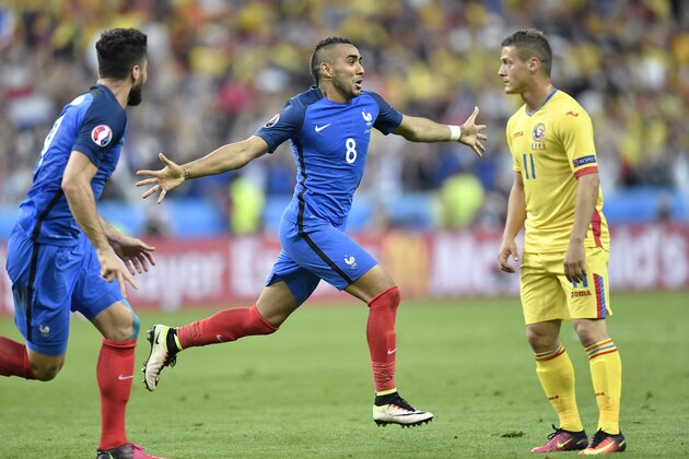France's Dimitri Payet, center, celebrates after scoring his side’s second goal during the Euro 2016 Group A soccer match between France and Romania, at the Stade de France, in Saint-Denis, north of Paris, Friday, June 10, 2016.  (AP Photo/Martin Meissner)