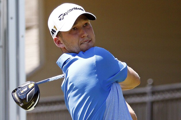Daniel Berger studies his drove off the 18th tee on the second day of the FedEx St. Jude Classic golf tournament, Friday, June 10, 2016, in Memphis, Tenn.  (AP Photo/Rogelio V. Solis)