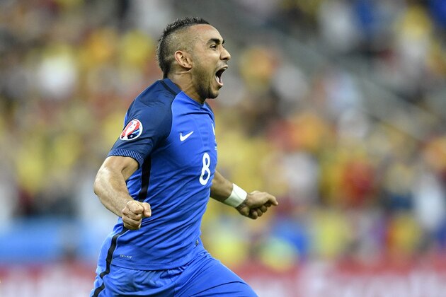 France's Dimitri Payet celebrates after scoring his side’s second goal during the Euro 2016 Group A soccer match between France and Romania, at the Stade de France, in Saint-Denis, north of Paris, Friday, June 10, 2016.  (AP Photo/Martin Meissner)