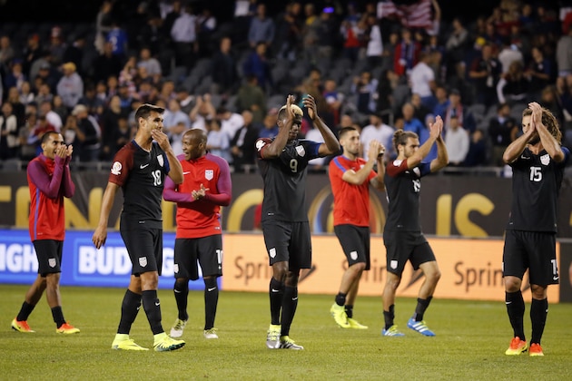United States team celebrates after defeating Costa Rica, 4-0, in a Copa America Centenario group A soccer match at Soldier Field in Chicago, Tuesday, June 7, 2016. (AP Photo/Charles Rex Arbogast)