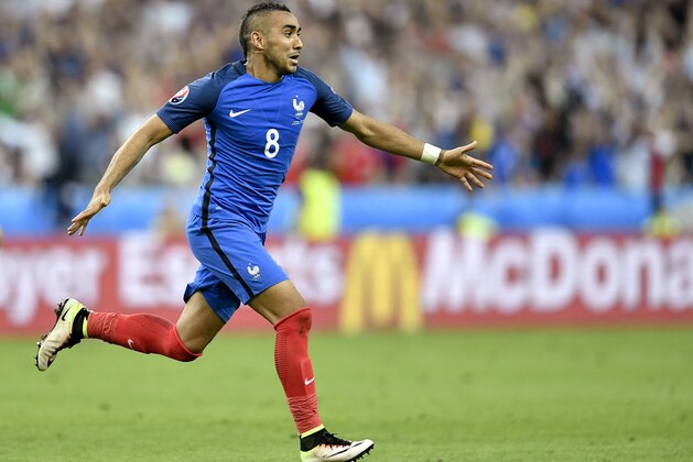 France's Dimitri Payet celebrates after scoring his side’s second goal during the Euro 2016 Group A soccer match between France and Romania, at the Stade de France, in Saint-Denis, north of Paris, Friday, June 10, 2016. (AP Photo/Martin Meissner)