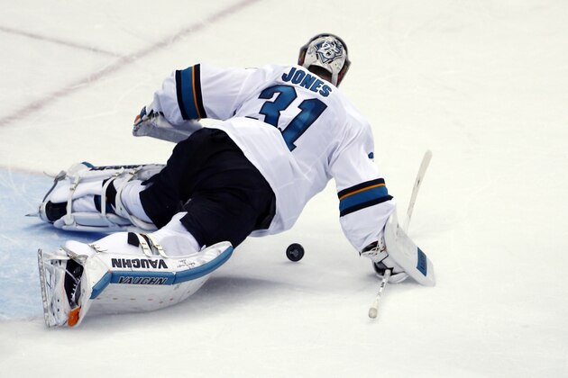 San Jose Sharks goalie Martin Jones covers the puck during the second period in Game 5 of the NHL hockey Stanley Cup Finals against the Pittsburgh Penguins  on Thursday, June 9, 2016, in Pittsburgh. (AP Photo/Gene J. Puskar)