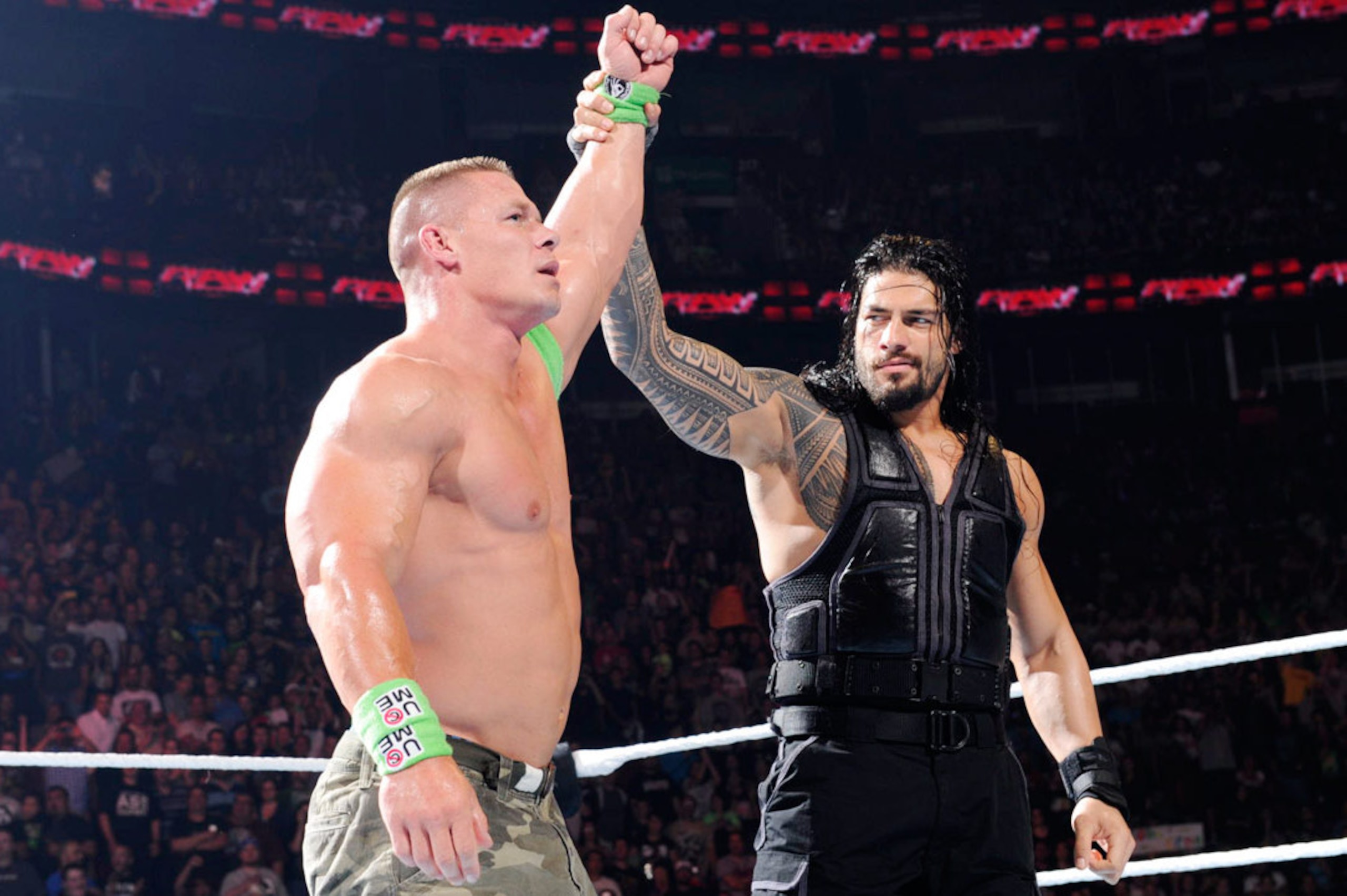 Roman Reigns and John Cena at an episode of Raw.