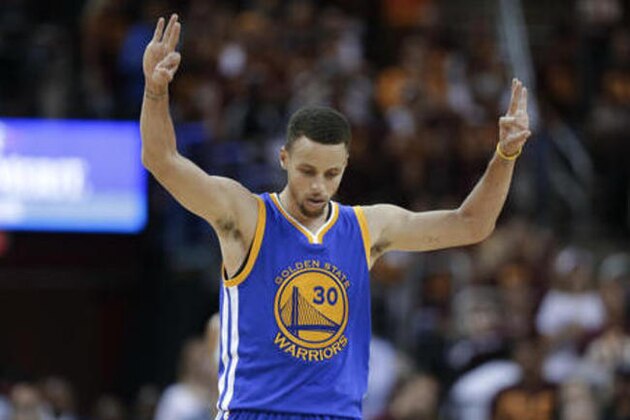 Golden State Warriors guard Stephen Curry celebrates a basket against the Cleveland Cavaliers during the second half of Game 4 of basketball's NBA Finals in Cleveland, Friday, June 10, 2016. (AP Photo/Tony Dejak)