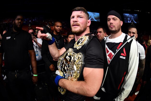 INGLEWOOD, CA - JUNE 04: Michael Bisping of England stands with his title belt after his first round knockout win against Luke Rockhold in their UFC middleweight championship bout during the UFC 199 event at The Forum on June 4, 2016 in Inglewood, California.  (Photo by Harry How/Zuffa LLC/Zuffa LLC via Getty Images)