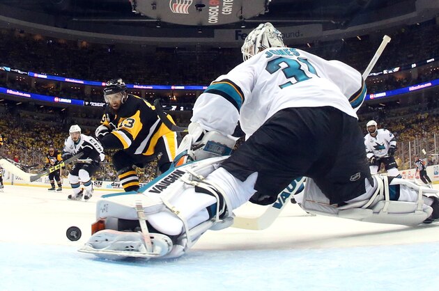 San Jose Sharks goalie Martin Jones (31) makes a save with his left pad on a shot by Pittsburgh Penguins' Nick Bonino (13) during the second period in Game 5 of the NHL hockey Stanley Cup Finals on Thursday, June 9, 2016, in Pittsburgh. (Bruce Bennett/Pool Photo via AP)