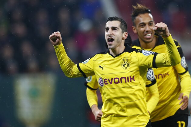 Dortmund's Henrikh Mkhitaryan celebrates after scoring his side's second goal during the German soccer cup (DFB Pokal) match between FC Augsburg and Borussia Dortmund at the WWK Arena stadium in Augsburg, Germany, Wednesday, Dec. 16, 2015. (AP Photo/Matthias Schrader)