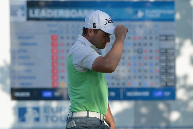 ATZENBRUGG, AUSTRIA - JUNE 10:  Zander Lombard of South Africa thanks the crowed after finishing his round as leader on 18 during the second round of The Lyoness Open at Diamond Country Club on June 10, 2016 in Atzenbrugg, Austria.  (Photo by Mark Runnacles/Getty Images)