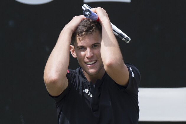 Austria's Dominic Thiem celebrates after winning against Switzerland's Roger Federer in their semifinal match at the ATP Mercedes Cup tennis tournament in Stuttgart, southwestern Germany, on June 11, 2016.  / AFP / THOMAS KIENZLE        (Photo credit should read THOMAS KIENZLE/AFP/Getty Images)