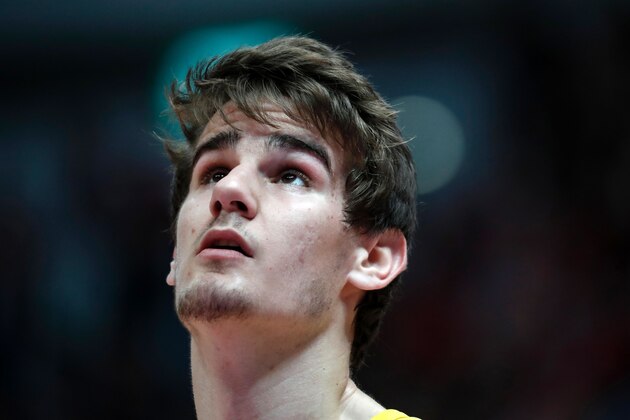 Maccabi Tel Aviv's Croatian player Dragen Bender reacts during a Winner League match between Maccabi Tel Aviv and Hapoel Jerusalem at the Pais Arena in Jerusalem on March 21, 2016.

Dragan Bender's name is not yet well known beyond hardcore basketball fans, but that may soon change. Bender, currently playing for Israeli club Maccabi Tel Aviv, is expected to be highly sought after by US professional basketball teams in the coming months.
 / AFP / THOMAS COEX        (Photo credit should read THOMAS COEX/AFP/Getty Images)