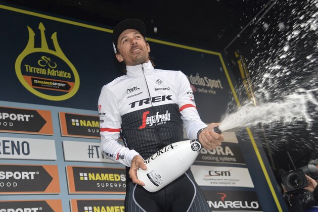 Switzerland's Fabian Cancellara celebrates on the podium after winning the last stage of the Tirreno Adriatico cycling race, in San Benedetto del Tronto, Italy, Tuesday, March 15, 2016. (Luca Zennaro/ANSA via AP)
