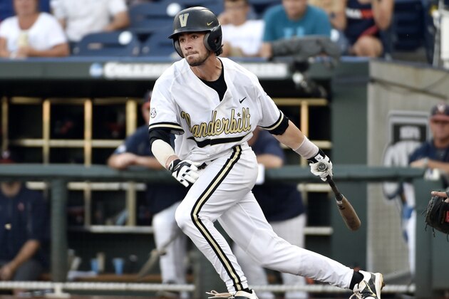 Vanderbilt' Dansby Swanson grounds out to third base scoring Bryan Reynolds against Virginia during the first inning of Game 3 of the best-of-three NCAA baseball College World Series finals at TD Ameritrade Park in Omaha, Neb., Wednesday, June 24, 2015. (AP Photo/Mike Theiler)