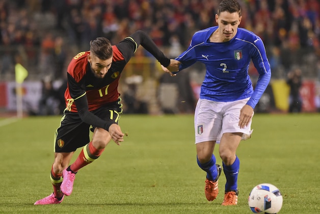 FILE - In this Friday, Nov. 13, 2015 file photo, Belgium's Belgium’s Yannick Carrasco, left,  right, fights for the ball with Italy’s Mattia De Sciglio during a friendly soccer match at the King Baudouin stadium in Brussels. The European Championship has a reputation for being the soccer fans’ favorite tournament on the global calendar. (AP Photo/Geert Vanden Wijngaert, File)