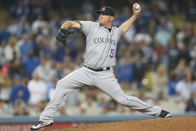 LOS ANGELES, CALIFORNIA - JUNE 08:  Closer Jake McGee #51 of the Colorado Rockies throws a pitch in the ninth inning on his way to picking up the save against the Los Angeles Dodgers at Dodger Stadium on June 8, 2016 in Los Angeles, California.  The Rockies won 1-0.  (Photo by Stephen Dunn/Getty Images)