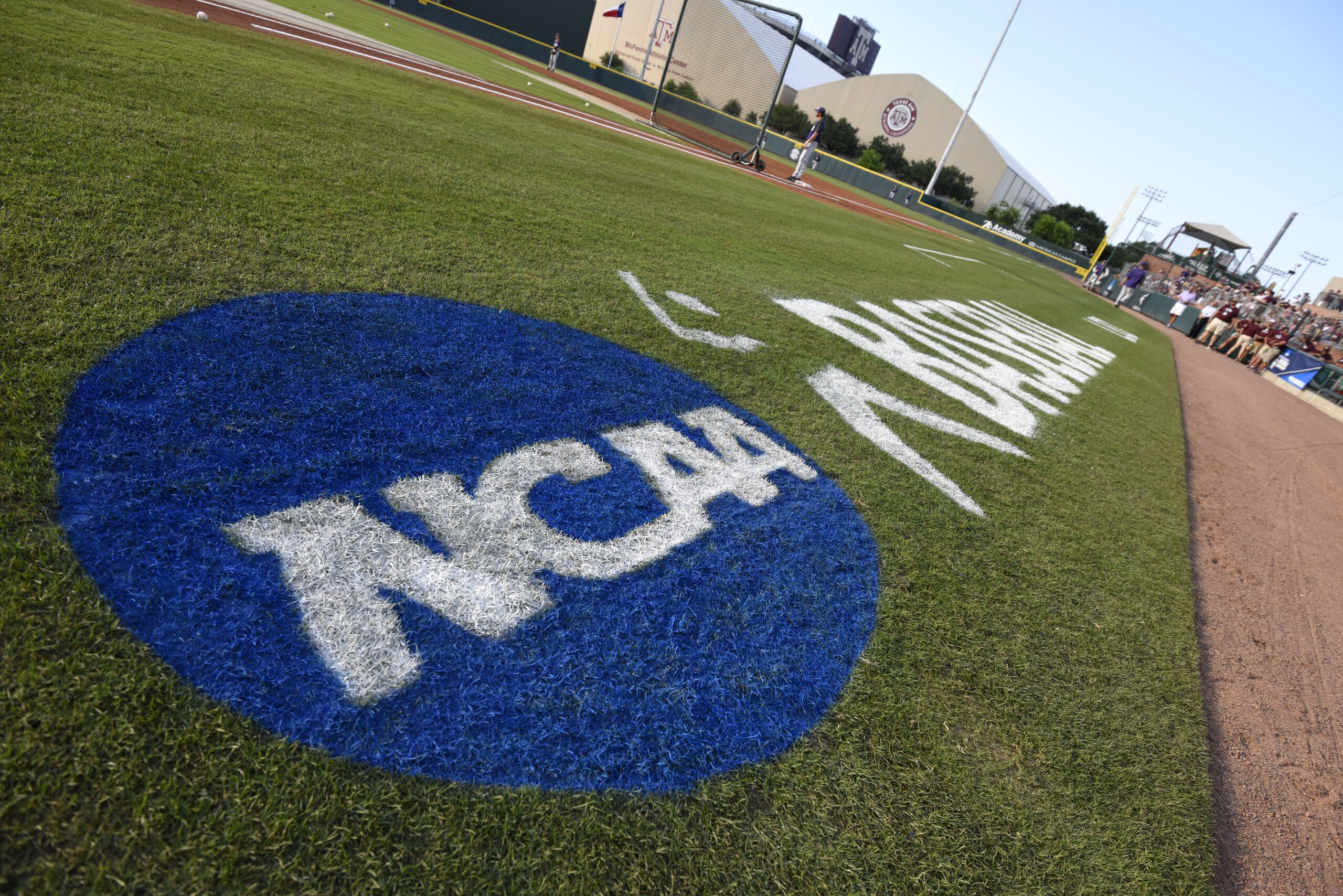 The NCAA logo is painted alongside the visitor dugout at Olsen Field before the start of a NCAA college baseball super regional tournament game between TCU and Texas A&M, Friday, June 10, 2016, in College Station, Texas. TCU won game one of the series 8-2. (AP Photo/Sam Craft) The NCAA logo is painted alongside the visitor dugout at Olsen Field before the start of a NCAA college baseball super regional tournament game between TCU and Texas A&M, Friday, June 10, 2016, in College Station, Texas. TCU won game one of the series 8-2. (AP Photo/Sam Craft)
