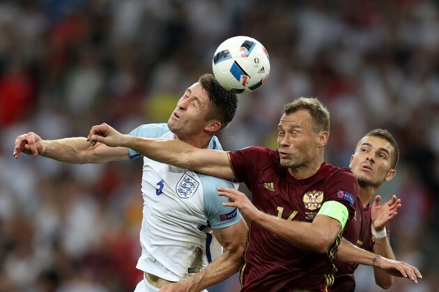 England's defender Gary Cahill (L) vies with Russia's defender Vasily Berezutskiy during the Euro 2016 group B football match between England and Russia at the Stade Velodrome in Marseille on June 11, 2016. / AFP / Valery HACHE        (Photo credit should read VALERY HACHE/AFP/Getty Images)