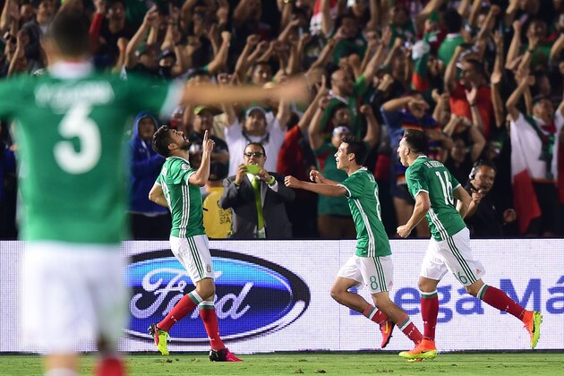 Mexico's Oribe Peralta (2nd L) celebrates with Hirving Lozano and Hector Herrera (R) after scoring the team's second goal against Jamaica during the Copa America Centenario football match in Pasadena, California, United States, on June 9, 2016.  / AFP / Frederic J. Brown        (Photo credit should read FREDERIC J. BROWN/AFP/Getty Images)