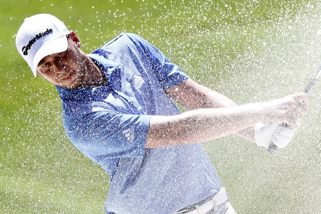 Daniel Berger hits out of a sand trap on the 18th fairway on the second day of the FedEx St. Jude Classic golf tournament, Friday, June 10, 2016, in Memphis, Tenn.  (AP Photo/Rogelio V. Solis)