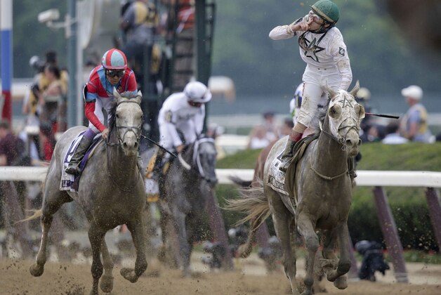 Irad Ortiz Jr., riding Creator, celebrates after winning the 148th running of the Belmont Stakes horse race, Saturday, June 11, 2016, in Elmont, N.Y. (AP Photo/Peter Morgan)