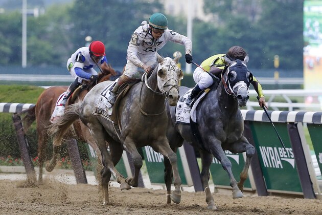 Jockey Irad Ortiz Jr. rides Creator across the finish line to win the 148th running of the Belmont Stakes horse race, Saturday, June 11, 2016, in Elmont, N.Y. (AP Photo/Kathy Willens)