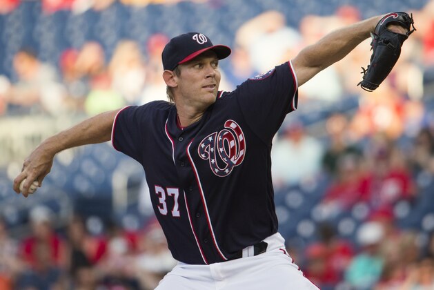 Washington Nationals starting pitcher Stephen Strasburg winds up during the first inning of a baseball game against the Philadelphia Phillies at Nationals Park, Friday, June 10, 2016, in Washington. (AP Photo/Evan Vucci)