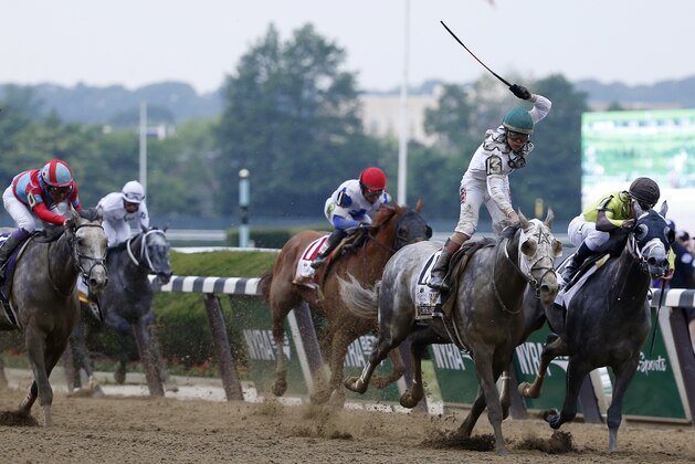 Jockey Irad Ortiz Jr., riding Creator, celebrates after winning the 148th running of the Belmont Stakes horse race, Saturday, June 11, 2016, in Elmont, N.Y. (AP Photo/Kathy Willens)