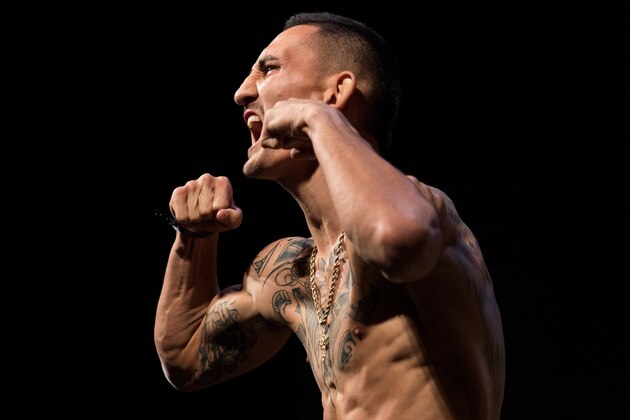 INGLEWOOD, CA - JUNE 03:   Max Holloway steps onto the scale during the UFC 199: Weigh-in Event at the Forum on June 3, 2016 in Inglewood, California. (Photo by Brandon Magnus/Zuffa LLC/Zuffa LLC via Getty Images)