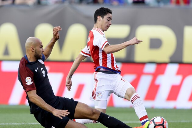 PHILADELPHIA, PA - JUNE 11:  Miguel Almiron #17 of Paraguay tries to keep the ball as John Brooks #6 of United States slides in the first half during the Copa America Centenario Group C match at Lincoln Financial Field on June 11, 2016 in Philadelphia, Pennsylvania.  (Photo by Elsa/Getty Images)