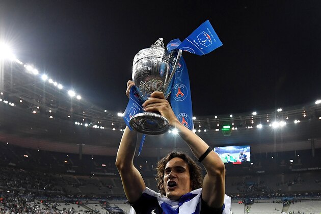 TOPSHOT - Paris Saint-Germain's Uruguayan forward Edinson Cavani holds the trophy as he celebrates after winning the French Cup final football match against Marseille (OM) on May 21, 2016 at the Stade de France in Saint-Denis, north of Paris.  AFP PHOTO / FRANCK FIFE / AFP / FRANCK FIFE        (Photo credit should read FRANCK FIFE/AFP/Getty Images)