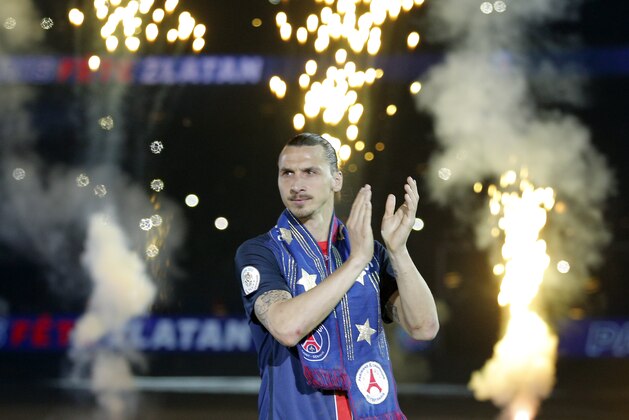 PSG's Zlatan Ibrahimovic, arrives to celebrate with teammates, the French League one title, after the match between PSG and Nantes at the Parc des Princes stadium in Paris, France, Saturday, May 14, 2016. Ibrahimovic played his final match at PSG's home ground and said he will leave Paris Saint-Germain at the end of the season. (AP Photo/Christophe Ena)