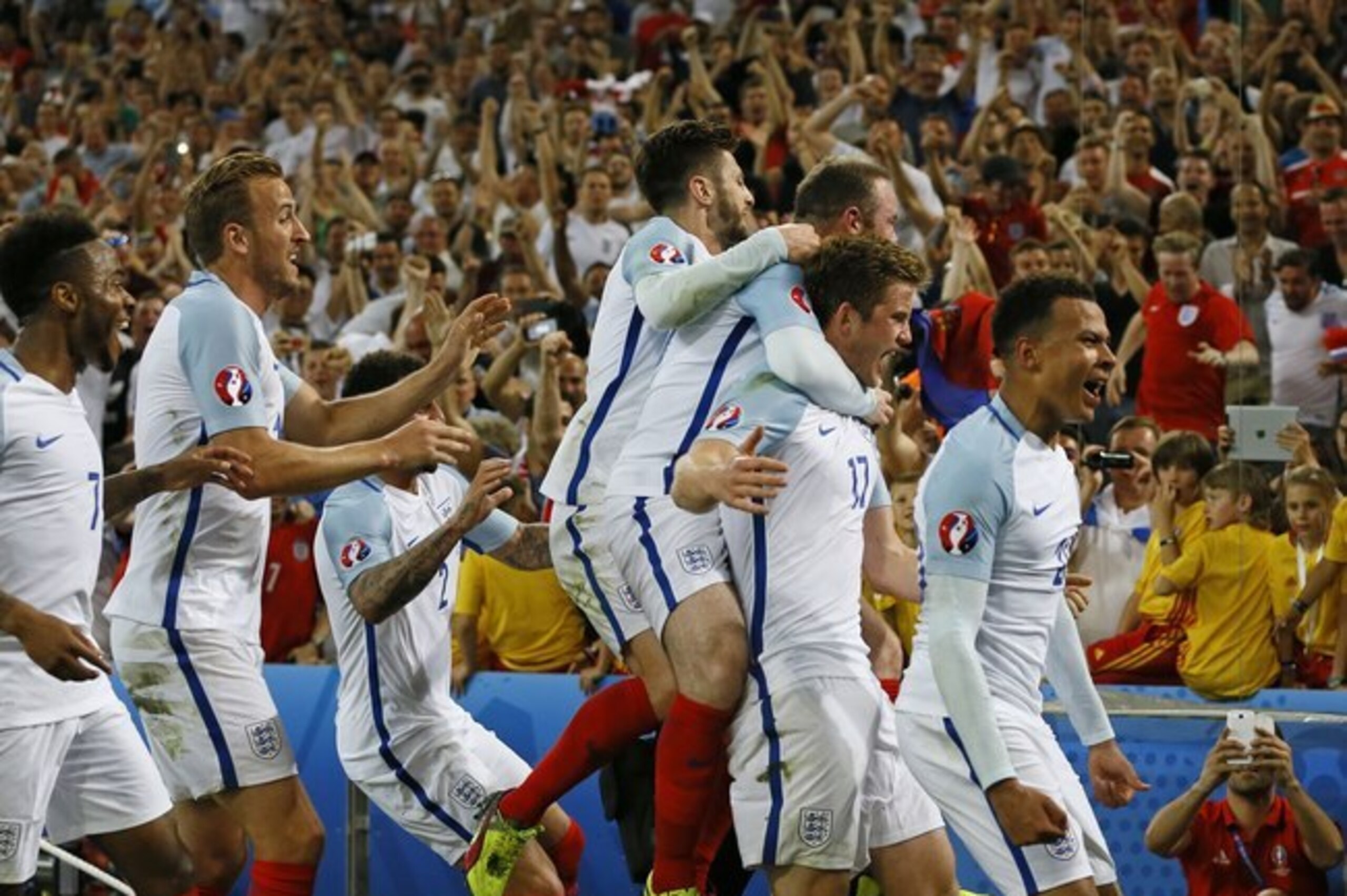 England's Eric Dier, 2nd right, celebrates after scoring the opening goal during the Euro 2016 Group B soccer match between England and Russia, at the Velodrome stadium in Marseille, France, Saturday, June 11, 2016. (AP Photo/Kirsty Wigglesworth)