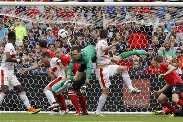 Switzerland's Fabian Schaer, center, scores his side's first goal on a header, during the Euro 2016 Group A soccer match between Albania and Switzerland, at the Bollaert stadium in Lens, France, Saturday, June 11, 2016. (AP Photo/Frank Augstein)