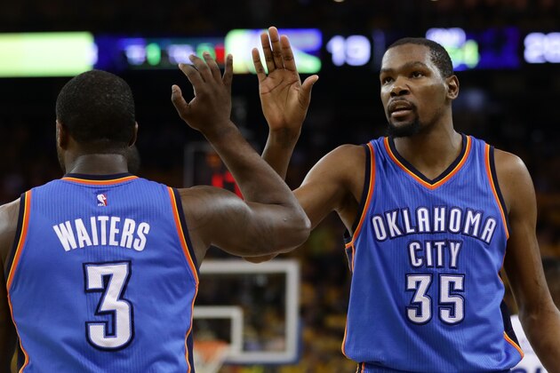 OAKLAND, CA - MAY 30:  Kevin Durant #35 of the Oklahoma City Thunder high-fives Dion Waiters #3 in Game Seven of the Western Conference Finals against the Golden State Warriors during the 2016 NBA Playoffs at ORACLE Arena on May 30, 2016 in Oakland, California. NOTE TO USER: User expressly acknowledges and agrees that, by downloading and or using this photograph, User is consenting to the terms and conditions of the Getty Images License Agreement.  (Photo by Ezra Shaw/Getty Images)