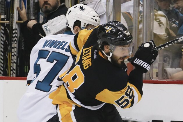 San Jose Sharks' Tommy Wingels (57) plays against Pittsburgh Penguins' Kris Letang (58)  during the second period in Game 2 of the NHL hockey Stanley Cup Finals on Wednesday, June 1, 2016, in Pittsburgh. (AP Photo/Keith Srakocic)