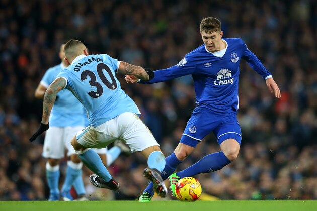 MANCHESTER, ENGLAND - JANUARY 27:  Nicolas Otamendi of Manchester City and John Stones of Everton compete for the ball during the Capital One Cup Semi Final, second leg match between Manchester City and Everton at the Etihad Stadium on January 27, 2016 in Manchester, England.  (Photo by Alex Livesey/Getty Images)