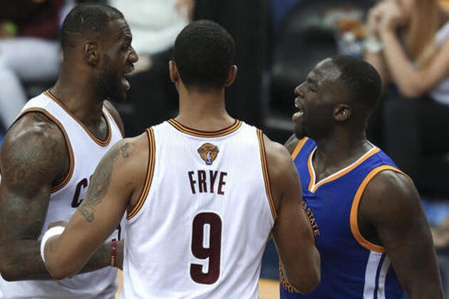 Golden State Warriors forward Draymond Green, right, and Cleveland Cavaliers forward LeBron James, left, argue while being separated by Channing Frye (9) during the second half of Game 4 of basketball's NBA Finals in Cleveland, Friday, June 10, 2016. The Warriors won 108-97. (AP Photo/Ron Schwane)