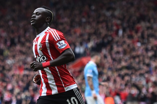 Southampton's Senegalese midfielder Sadio Mane (L) celebrates after scoring during the English Premier League football match between Southampton and Manchester City at St Mary's Stadium in Southampton, southern England on May 1, 2016. / AFP / BEN STANSALL / RESTRICTED TO EDITORIAL USE. No use with unauthorized audio, video, data, fixture lists, club/league logos or 'live' services. Online in-match use limited to 75 images, no video emulation. No use in betting, games or single club/league/player publications.  /         (Photo credit should read BEN STANSALL/AFP/Getty Images)