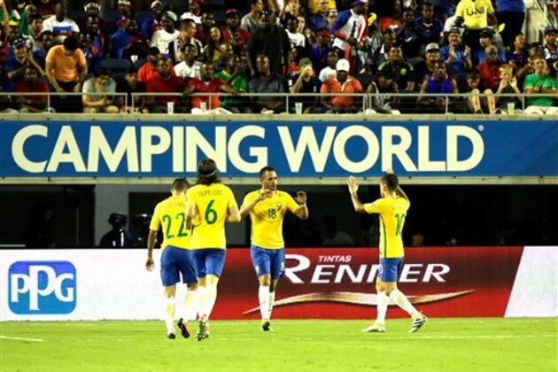 Brazil's Renato Augusto (18) celebrates his goal against Haiti with teammates during the second half of a Copa America group B soccer match at Camping World Stadium, Wednesday, June 8, 2016, in Orlando, Fla. Brazil won 7-1. (AP Photo/John Raoux)