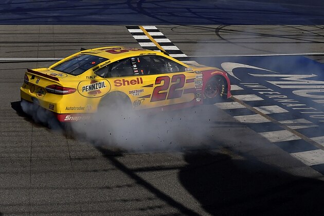 BROOKLYN, MI - JUNE 12:  Joey Logano, driver of the #22 Shell Pennzoil Ford, celebrates with a burnout after winning the NASCAR Sprint Cup Series FireKeepers Casino 400 at Michigan International Speedway on June 12, 2016 in Brooklyn, Michigan.  (Photo by Josh Hedges/Getty Images )