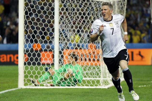Germany's Bastian Schweinsteiger celebrates after scoring his side's second goal during the Euro 2016 Group C soccer match between Germany and Ukraine at the Pierre Mauroy stadium in Villeneuve d’Ascq, near Lille, France, Sunday, June 12, 2016. (AP Photo/Frank Augstein)