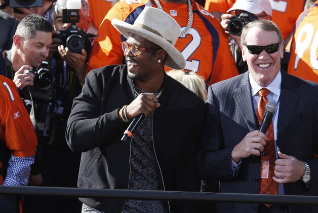Denver Broncos outside linebacker Von Miller, center, jokes with teammates at a rally following a parade through downtown Tuesday, Feb. 9, 2016 in Denver. Fans crowded into Denver's downtown to salute the Broncos for the team's victory over the Carolina Panthers in Super Bowl 50. (AP Photo/David Zalubowski)