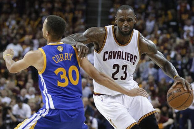 Cleveland Cavaliers forward LeBron James (23) tries to get around Golden State Warriors guard Stephen Curry (30) during the second half of Game 4 of basketball's NBA Finals in Cleveland, Friday, June 10, 2016. (AP Photo/Tony Dejak)