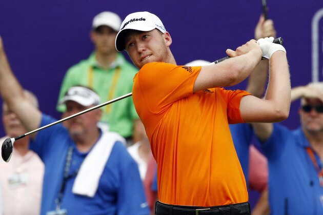 Daniel Berger watches his tee shot on the No. 1 tee of the FedEx St. Jude Classic Golf Tournament, Sunday, June 12, 2016, in Memphis, Tenn. Play was suspended due to hazardous weather. (AP Photo/Rogelio V. Solis)